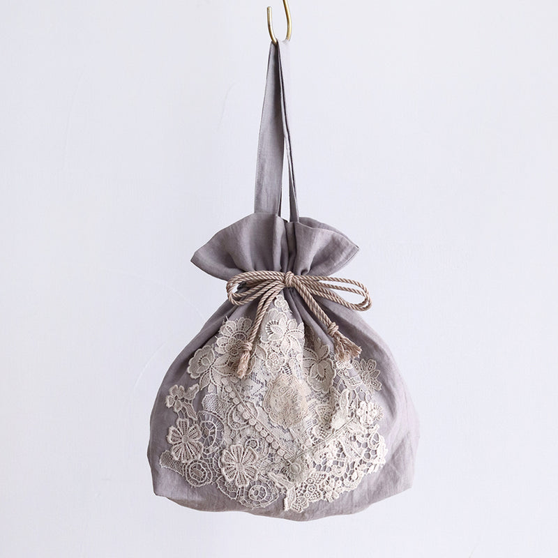lacy collage drawstring bag